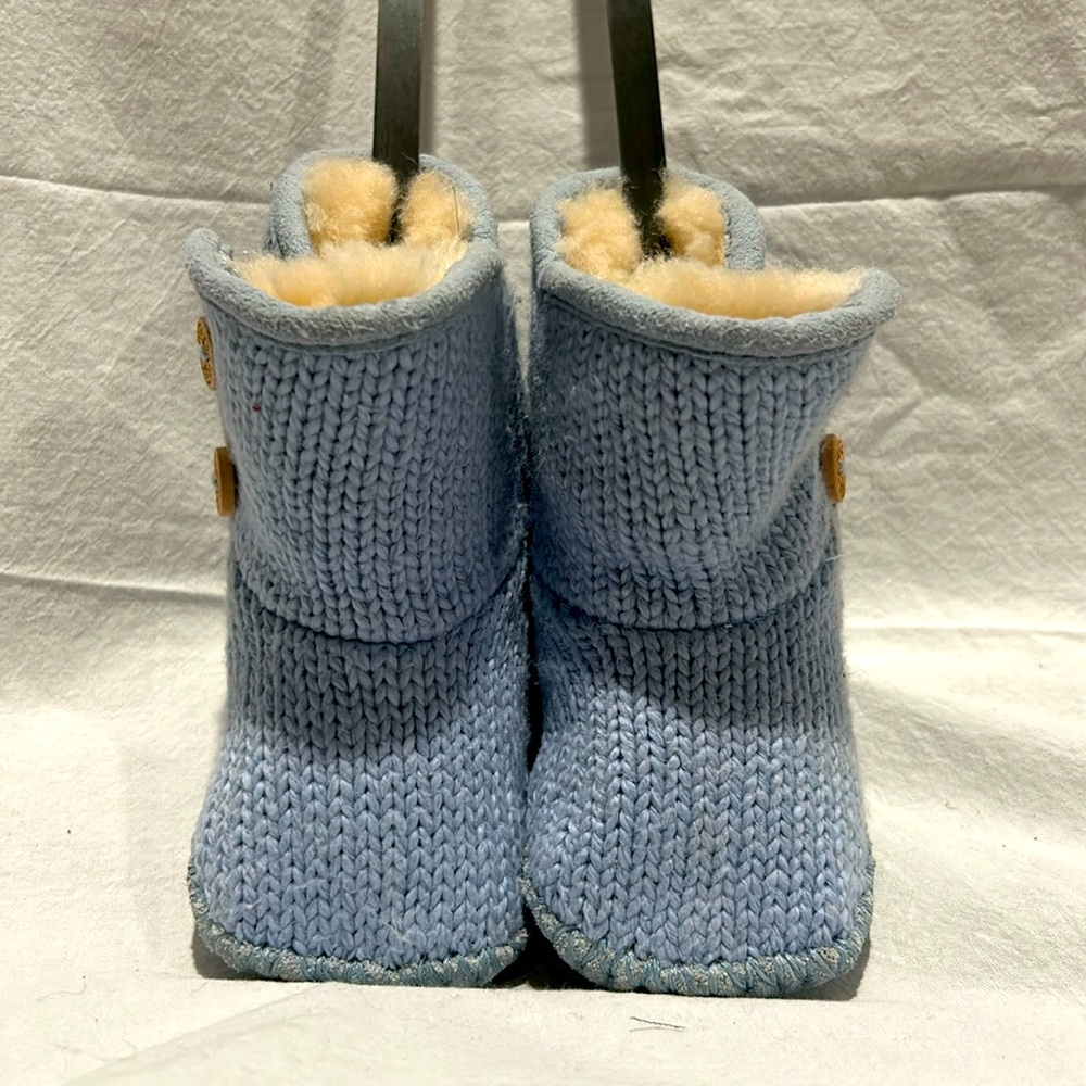 UGG size 0/1 USA, Baby Blue Cable Velcro closure with button detail.